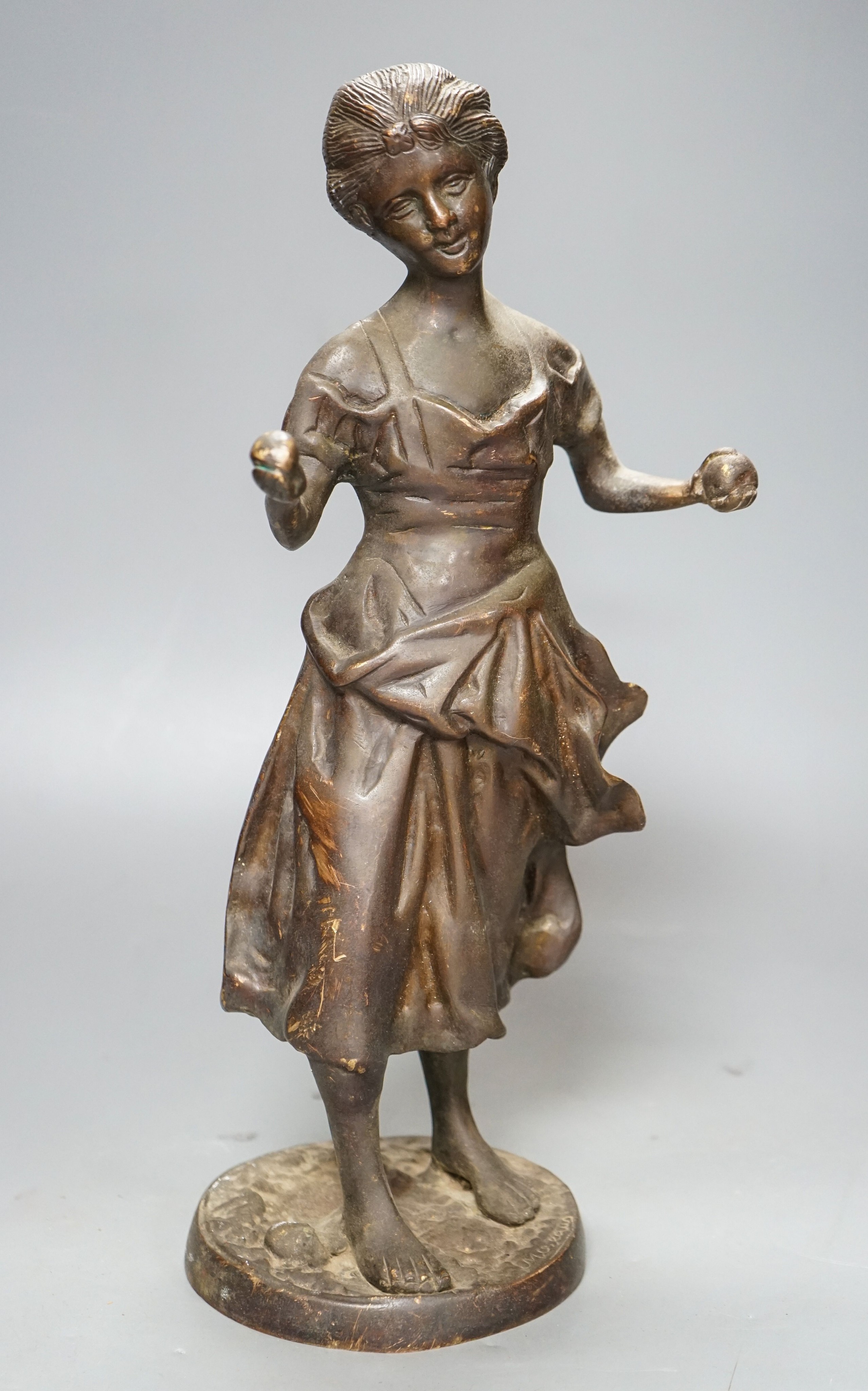 After Moreau. A bronze female figure, script signature to circular base, height 38cm